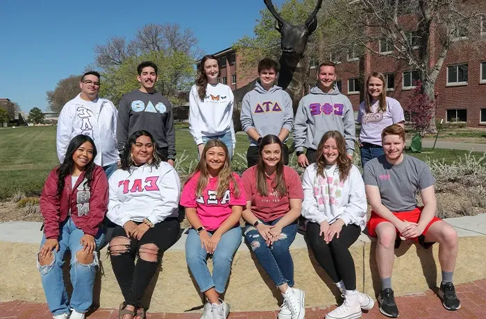 Fraternity and Sorority members posing for a photo